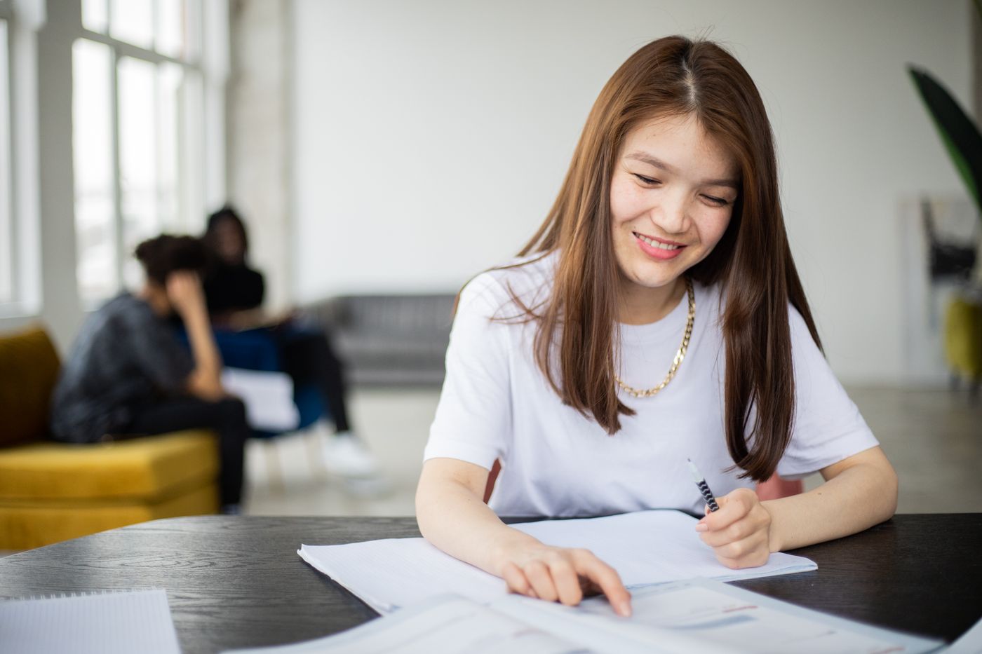 A student reading in a classroom